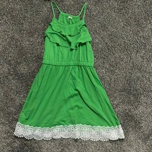 green dress with white hemings. size is large but fits like a small